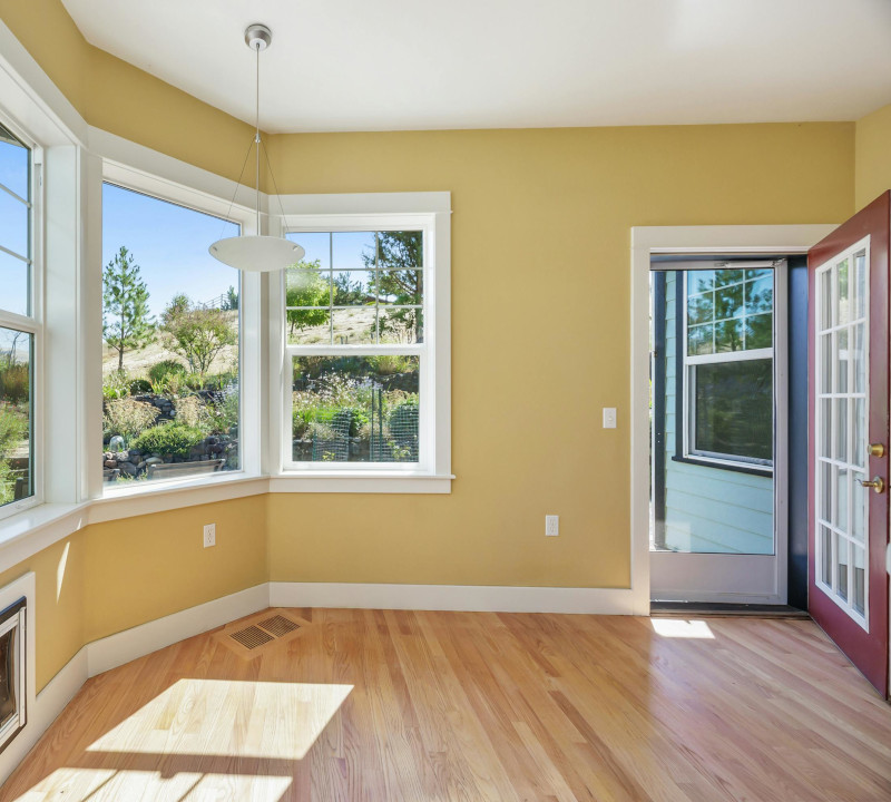An empty living room in a home.