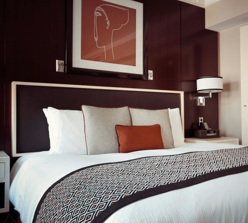 Bedroom with a neatly made bed.